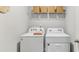 Convenient laundry room featuring a modern washer and dryer and ample storage space at 8840 Shovelnose Ct, North Charleston, SC 29406