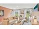 Comfortable living room with neutral décor, large windows, and an open layout for easy entertaining at 8840 Shovelnose Ct, North Charleston, SC 29406