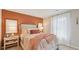 Charming main bedroom boasts an accent wall, bedside tables, and a plush, inviting bed at 8840 Shovelnose Ct, North Charleston, SC 29406