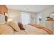 Relaxing main bedroom featuring warm accent wall and view to the outdoors at 8840 Shovelnose Ct, North Charleston, SC 29406