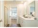 Bright bathroom featuring double sinks, a neutral color scheme, and a shower at 8854 Shovelnose Ct, North Charleston, SC 29406