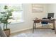 Well-lit office space featuring natural light, a desk, and a modern chair at 8854 Shovelnose Ct, North Charleston, SC 29406