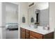 A Primary bathroom has double sinks, a vanity with drawers, and a view to the bedroom at 8921 Skipping Rock Ln, Summerville, SC 29485