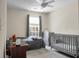 Neutral Bedroom with crib and changing table, offering a calming and serene environment at 8921 Skipping Rock Ln, Summerville, SC 29485