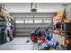 Organized garage with ample storage and natural light, ready for vehicles or hobbies at 8921 Skipping Rock Ln, Summerville, SC 29485