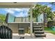 A covered hot tub is set on a concrete pad surrounded by lush landscaping at 8921 Skipping Rock Ln, Summerville, SC 29485