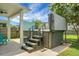 A hot tub on a concrete patio is set in a backyard with a privacy fence at 8921 Skipping Rock Ln, Summerville, SC 29485