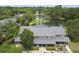 An aerial view of a townhome with a gray roof overlooking a scenic pond and lush greenery at 925 Dills Bluff Rd # 34, Charleston, SC 29412
