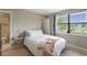 Bright bedroom with a view to the outside, featuring light-colored walls and wood flooring at 925 Dills Bluff Rd # 34, Charleston, SC 29412