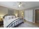 Comfortable bedroom with ceiling fan, a decorative rug, a queen bed and an adjoining bathroom at 925 Dills Bluff Rd # 34, Charleston, SC 29412