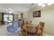 Inviting dining area with a round wooden table and chairs, adjacent to the living room at 925 Dills Bluff Rd # 34, Charleston, SC 29412