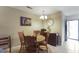 Cozy dining area with wooden furniture, light fixtures, and stylish decor accents at 925 Dills Bluff Rd # 34, Charleston, SC 29412