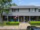 Exterior shot showcasing the townhome's entrance, American flag, and well-maintained landscaping at 925 Dills Bluff Rd # 34, Charleston, SC 29412