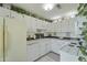 Bright kitchen with white cabinets, tiled countertops, and a clean, functional layout at 925 Dills Bluff Rd # 34, Charleston, SC 29412