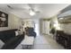 The living room features a ceiling fan, cozy seating, neutral decor, and tile floors at 925 Dills Bluff Rd # 34, Charleston, SC 29412