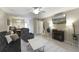 The living room features a ceiling fan, cozy seating, neutral decor, and tile floors at 925 Dills Bluff Rd # 34, Charleston, SC 29412