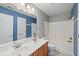 Bathroom with double vanity, bathtub and shower combination, toilet, and neutral tile floor at 9313 Sweetbay Ct, Ladson, SC 29456