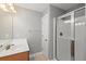 Bright bathroom features a vanity, a shower, tile floors, and neutral paint at 9313 Sweetbay Ct, Ladson, SC 29456