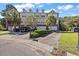 Attractive townhouse featuring palm trees, a private driveway, and an attached garage at 9313 Sweetbay Ct, Ladson, SC 29456