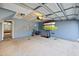 Spacious garage with surfboards and a bicycle at 9313 Sweetbay Ct, Ladson, SC 29456