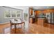 Bright eat-in kitchen features wood floors, stainless steel appliances, and a center island at 9313 Sweetbay Ct, Ladson, SC 29456