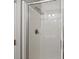 Shower stall with glass door, white tile surround, and brushed nickel fixtures at 9313 Sweetbay Ct, Ladson, SC 29456