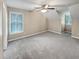 Carpeted bedroom with ceiling fan, window with mini blinds, and neutral paint at 932 Portabella Ln, Charleston, SC 29412