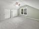 Cozy carpeted bedroom with ceiling fan, window with mini blinds, and closet at 932 Portabella Ln, Charleston, SC 29412