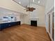 Bright, open living space featuring hardwood floors, fireplace, and view of the modern kitchen at 932 Portabella Ln, Charleston, SC 29412