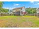 Good sized back yard showing screened in patio, partial fence, and blue skies at 100 Cicero Ct, Goose Creek, SC 29445