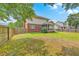 Spacious back yard featuring partial shade, wooden fence, and screened in patio at 100 Cicero Ct, Goose Creek, SC 29445