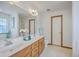 Bathroom features dual sinks, a large mirror, and tile floors at 100 Cicero Ct, Goose Creek, SC 29445
