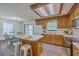 Bright kitchen with stainless appliances, center island, and dining area with sliding doors at 100 Cicero Ct, Goose Creek, SC 29445