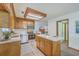 Open kitchen layout with stainless steel appliances and breakfast bar offers modern living at 100 Cicero Ct, Goose Creek, SC 29445