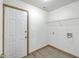 This laundry room features wooden floors, washer and dryer hookups, and wire shelving at 100 Cicero Ct, Goose Creek, SC 29445