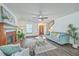 Cozy living room features a fireplace, ceiling fan, comfortable seating, and natural light at 100 Cicero Ct, Goose Creek, SC 29445