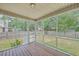 Spacious screened porch with wood floors and a view of the backyard at 100 Cicero Ct, Goose Creek, SC 29445