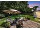 Scenic backyard featuring an outdoor patio, seating, a fire pit, and lush landscaping at 100 Conset Bay Ct, Goose Creek, SC 29445