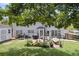 Spacious backyard with a fire pit, patio seating, and lush greenery at 100 Conset Bay Ct, Goose Creek, SC 29445