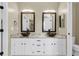 Bright bathroom with double vessel sinks, granite countertop, framed mirrors, and white cabinets at 100 Conset Bay Ct, Goose Creek, SC 29445