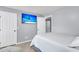 Bright bedroom with a comfortable bed, a mounted flat-screen TV, and two closets at 100 Conset Bay Ct, Goose Creek, SC 29445