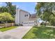 Attached two-car garage with a double-wide driveway offering ample parking space and curb appeal at 100 Conset Bay Ct, Goose Creek, SC 29445