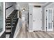 Entryway with staircase and hardwood floors; bright, neutral paint and plenty of natural light at 100 Conset Bay Ct, Goose Creek, SC 29445