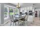 Eat-in kitchen featuring modern appliances, light fixtures, breakfast bar, and breakfast nook with natural light at 100 Conset Bay Ct, Goose Creek, SC 29445