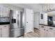 Kitchen featuring stainless steel refrigerator, and painted cabinets with dark countertops and updated appliances at 100 Conset Bay Ct, Goose Creek, SC 29445