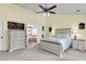 Main bedroom featuring carpet, ceiling fan, vaulted ceiling, and ensuite bathroom with a soaking tub at 100 Conset Bay Ct, Goose Creek, SC 29445