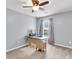 Functional home office with neutral carpet, a desk, a ceiling fan, and a window for natural light at 100 Conset Bay Ct, Goose Creek, SC 29445