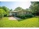 Backyard features a brick patio and a house with a brick facade at 100 S Gum St, Summerville, SC 29483