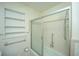 Traditional bathroom featuring a bathtub with a shower and neutral-toned tile at 100 S Gum St, Summerville, SC 29483