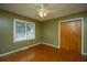 Charming bedroom with hardwood floors, a window view, a ceiling fan and a closet, perfect for relaxation at 100 S Gum St, Summerville, SC 29483